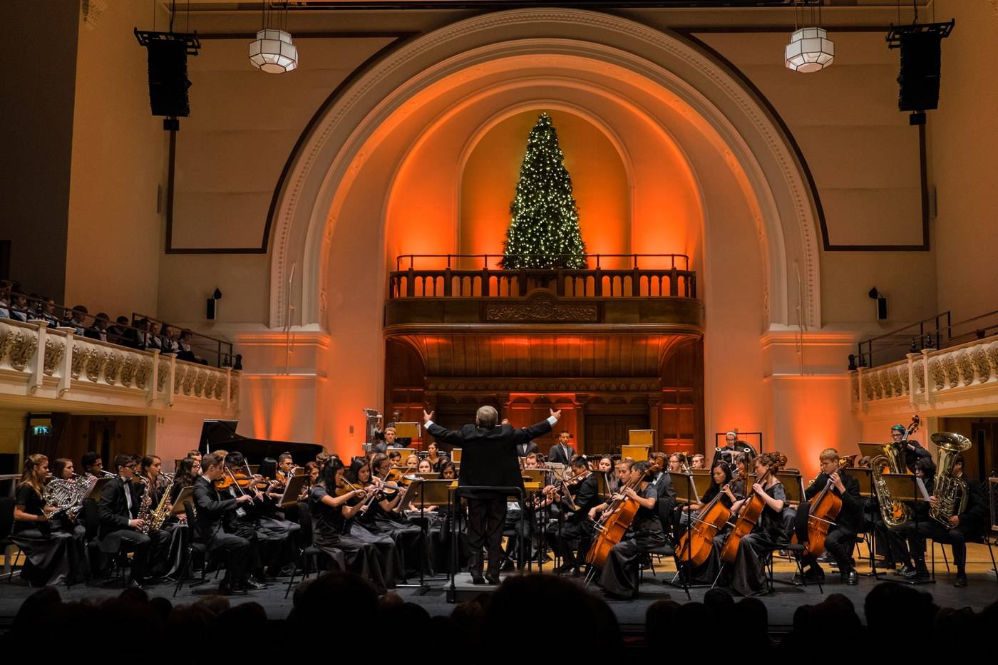 Mark Dahlberg conducting a full orchestra at Cadogan Hall in London — Florida band director and music educator with 35 years of experience